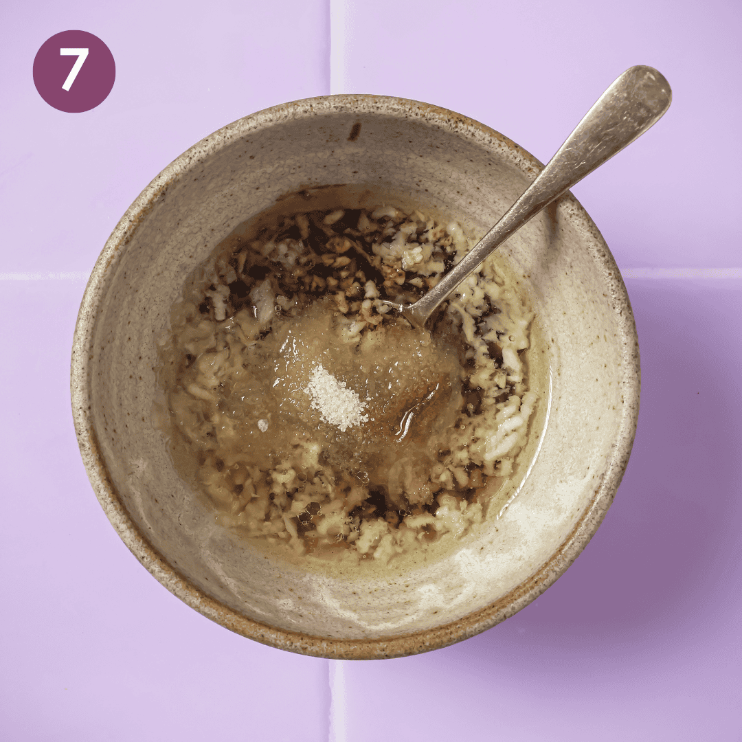 The soy sauce, rice vinegar, brown sugar, and white pepper on top of the garlic oil.