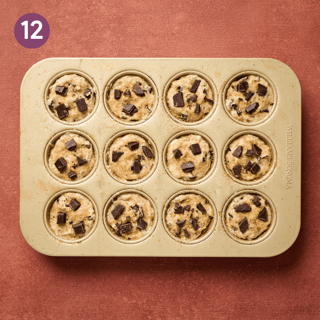 chocolate chips added to top of batter in muffin tin.
